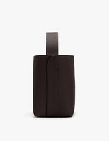 Side view of a leather pouch with a loop handle.