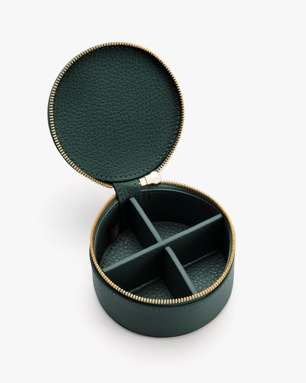 Round jewelry case with zipper and four compartments.