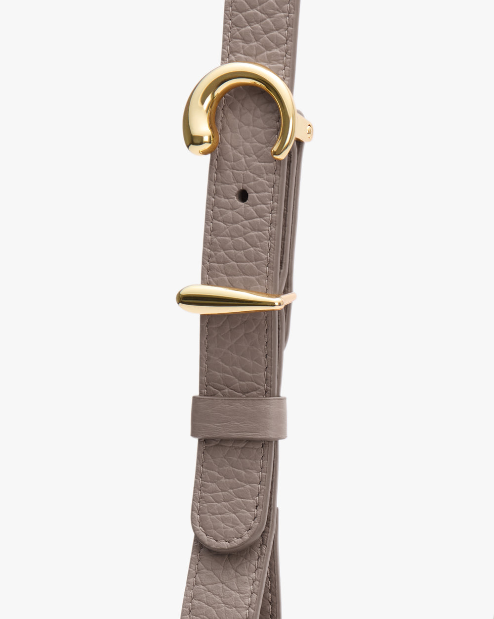 Close-up of a textured belt with gold buckle.