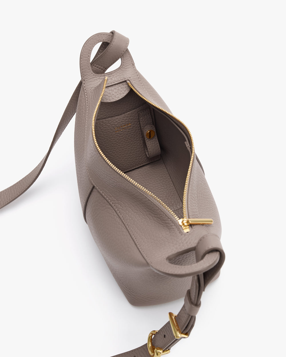 Open handbag with visible zipper, strap, and interior pocket.