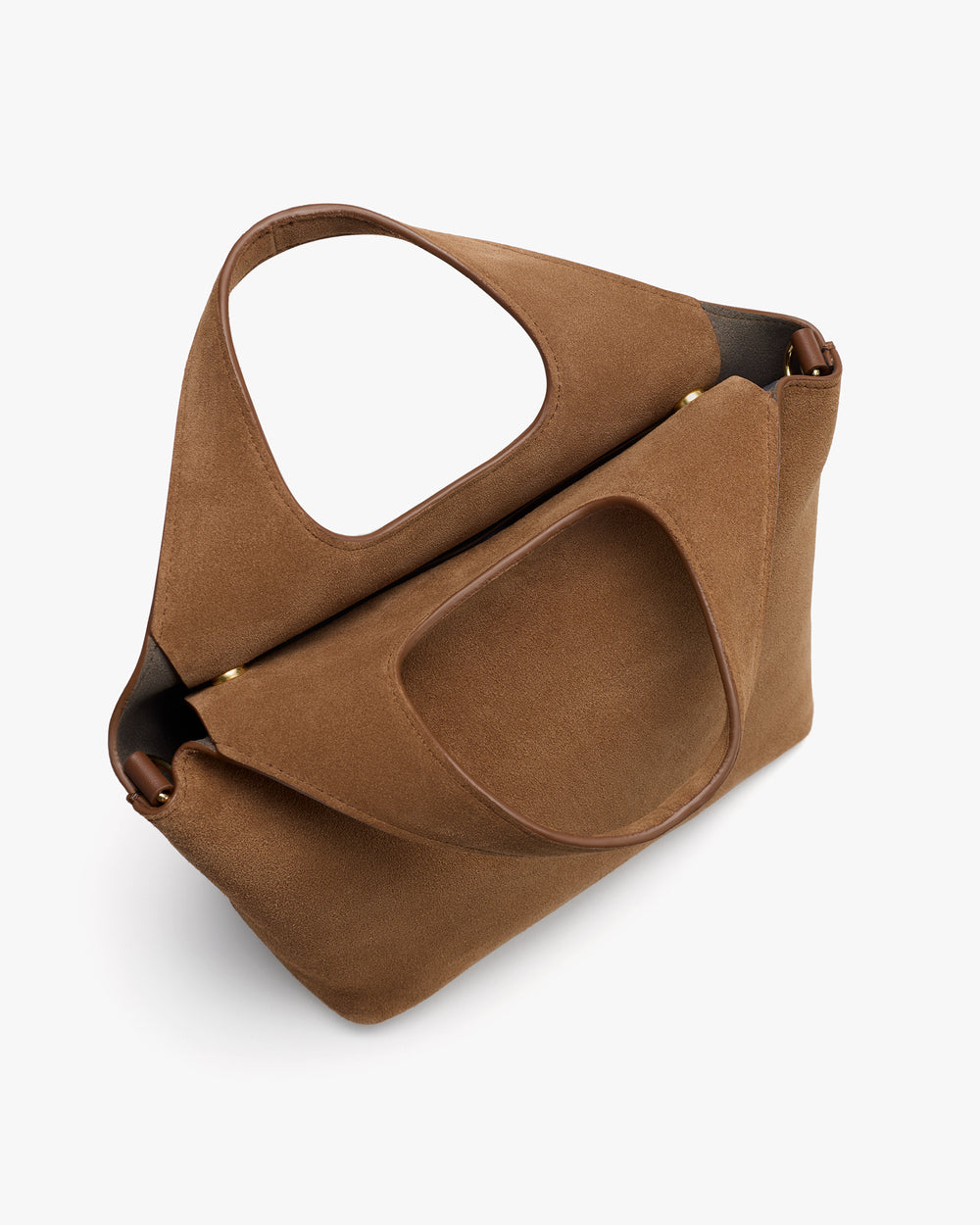Handbag with unique cutout handle design viewed from an angle.