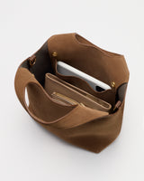 Open tote bag with phone and zippered pouch inside