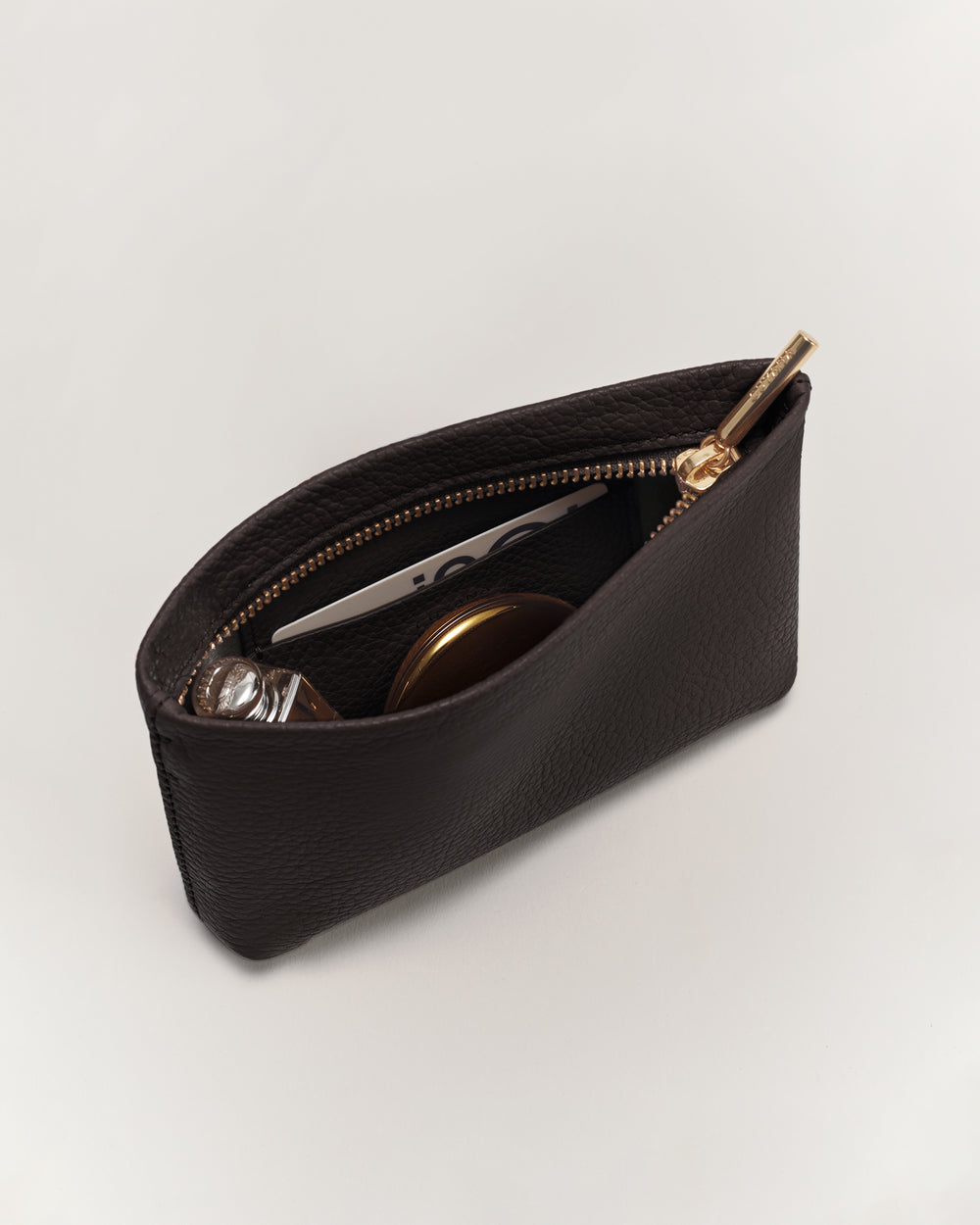 Open zipper pouch with items inside