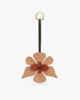 Floral keychain with a ring and strap attached.