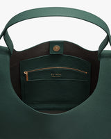 Open leather tote bag with pocket and zipper inside