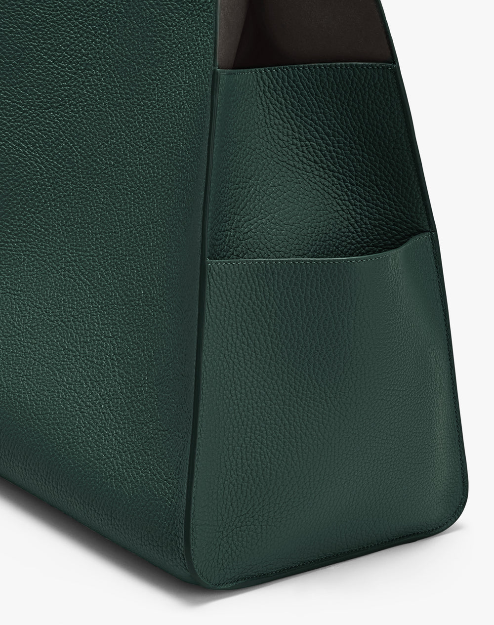 Close-up of a textured bag with a side pocket edge.