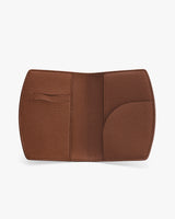 Open leather cardholder with multiple slots and a curved pocket.
