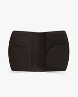 Open passport holder with multiple compartments.