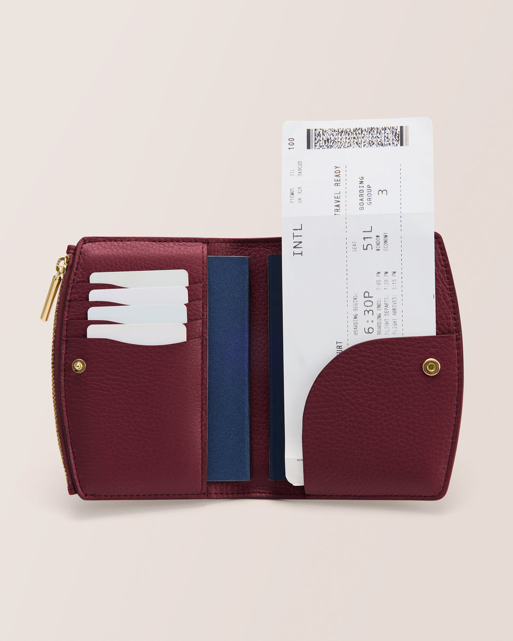 Open wallet with cards and a boarding pass inside