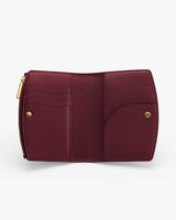 Open wallet showing various compartments and a zipper pocket.