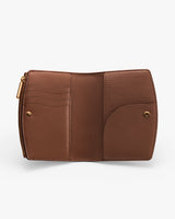 Open wallet showing card slots and compartments.