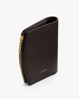 A zippered wallet standing upright with a brand name visible on one side.