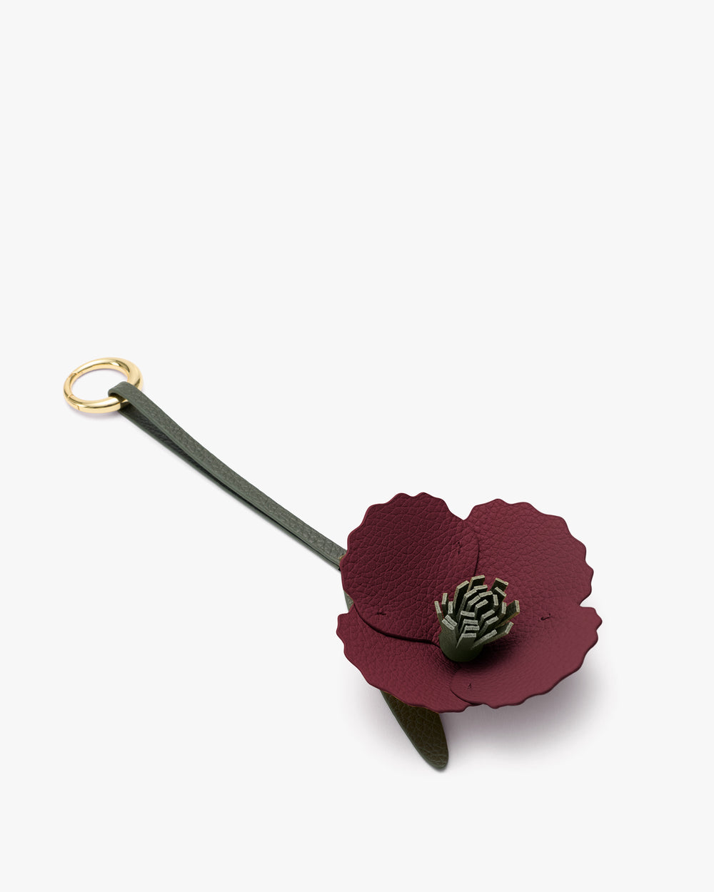 Leather flower keychain with ring and strap.