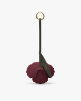 Flower-shaped keychain with a ring and strap.