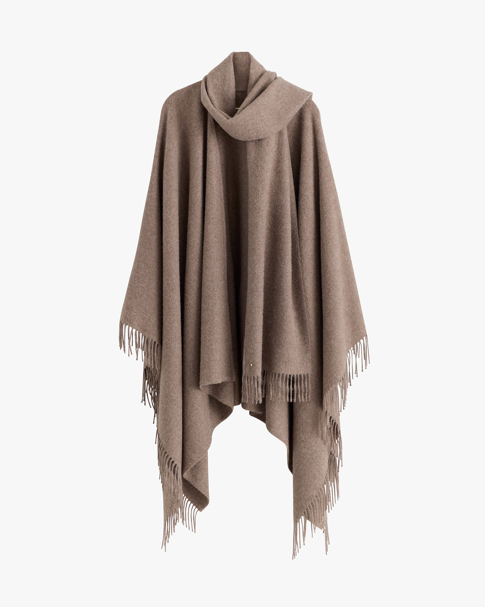 A cape with fringe detailing displayed on a plain backdrop.