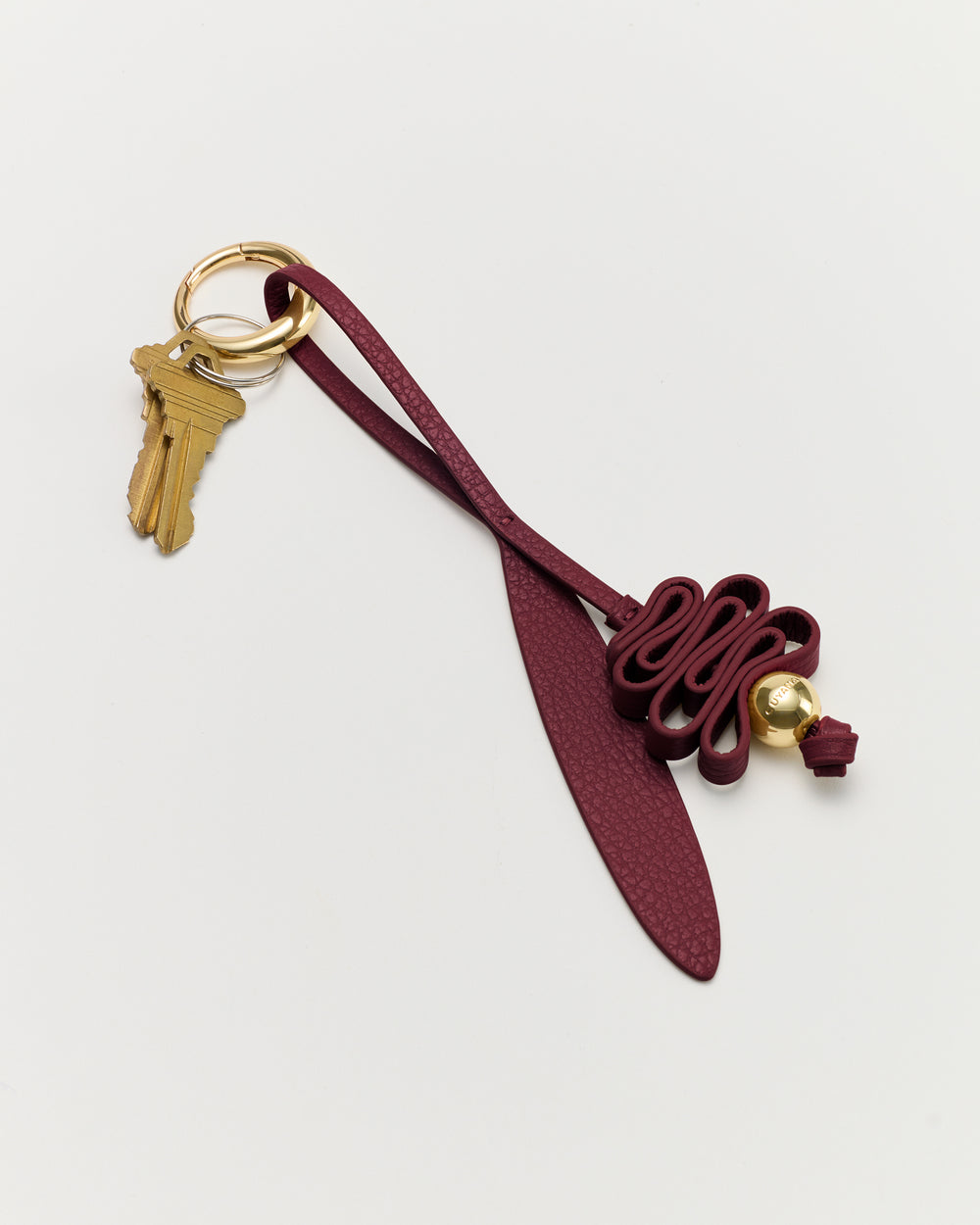Keychain with decorative leather loop and attached keys
