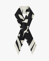 Silk scarf with abstract black and white pattern.