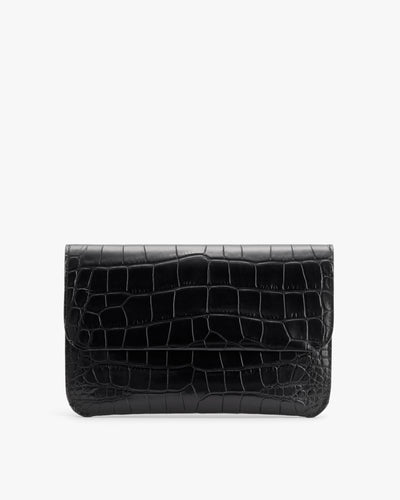 Rectangular clutch with croc-embossed leather design.