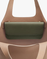Open handbag with a visible inner pocket flap