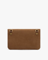 Rectangular clutch bag with two metal rings on one side.
