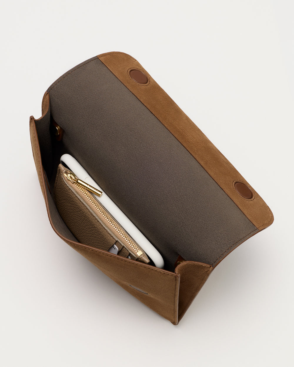 Open handbag with visible wallet and phone inside.