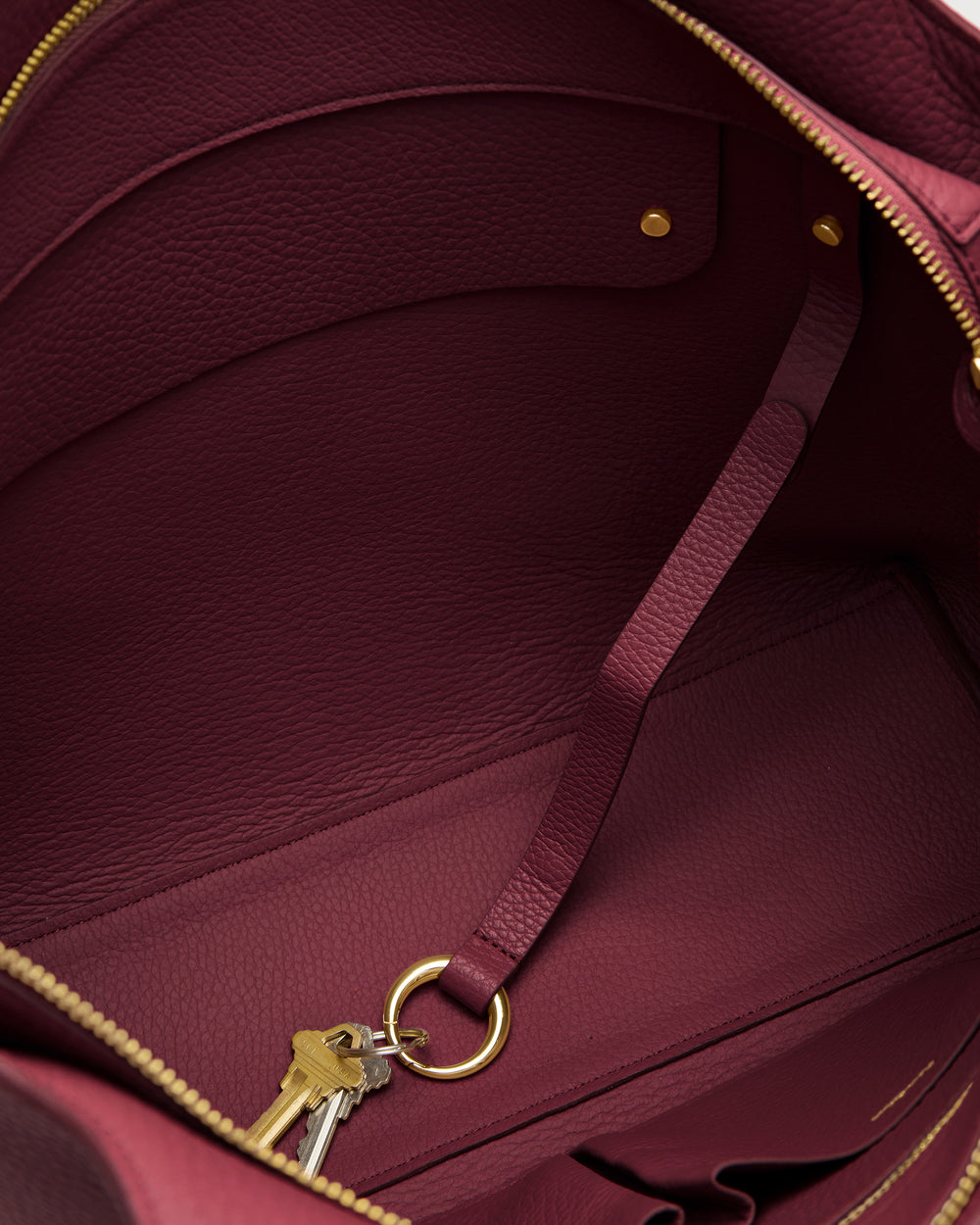 Open bag interior with attached key ring and keys.