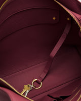Open bag interior with attached key ring and keys.