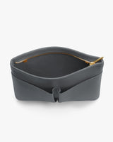 Open leather pouch with visible zipper.