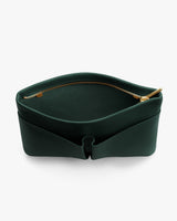 Open pouch with zipper and curved edge showing interior space