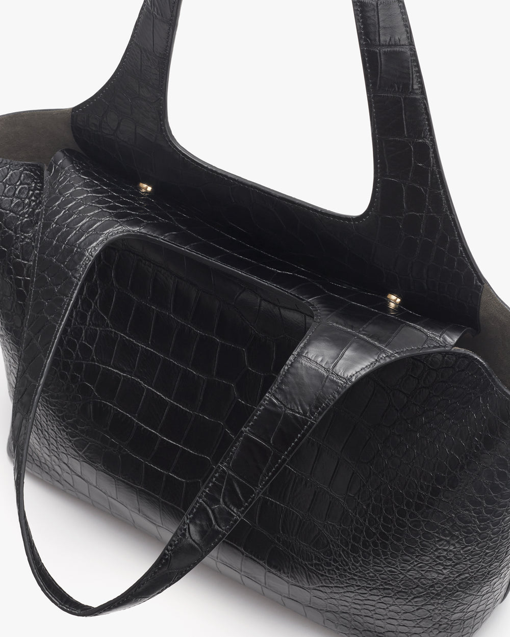 Croc-embossed leather travel bag with short handles.