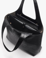 Tote bag with croc-embossed leather and open compartments.