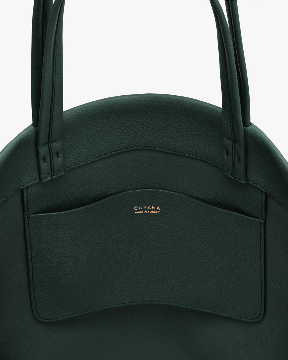 Close-up of a tote bag with pocket and handles.
