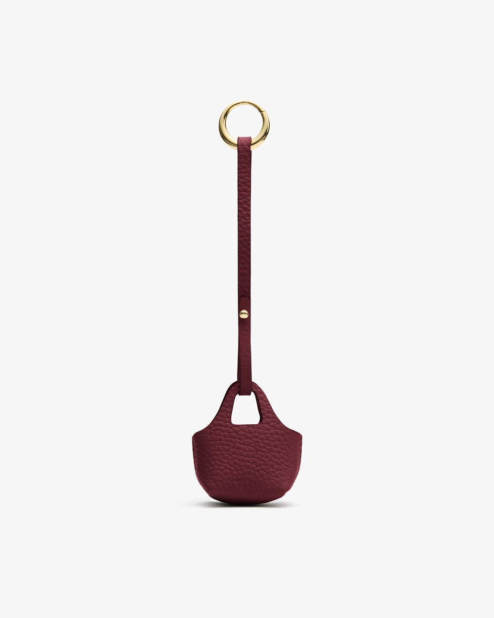 Small textured pouch with a long strap and a round metal ring at the top.