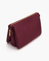 Rectangular purse with zipper on top edge.