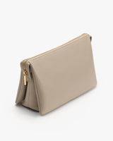Rectangular purse with zipper closure and a textured surface.