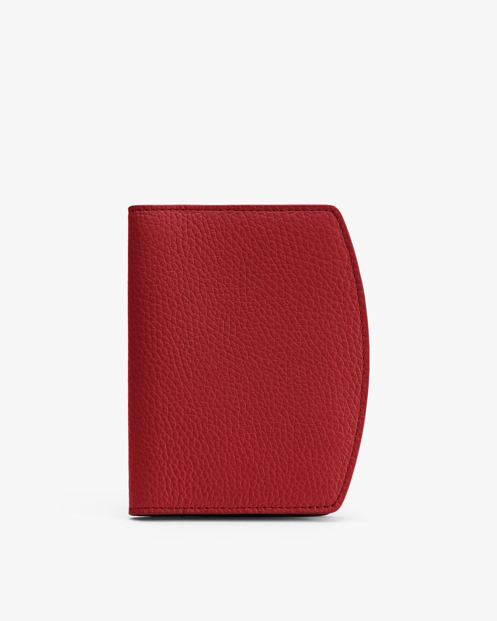 Red textured passport holder standing upright.