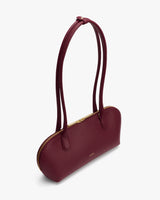 Long handbag with dual straps and a zip closure