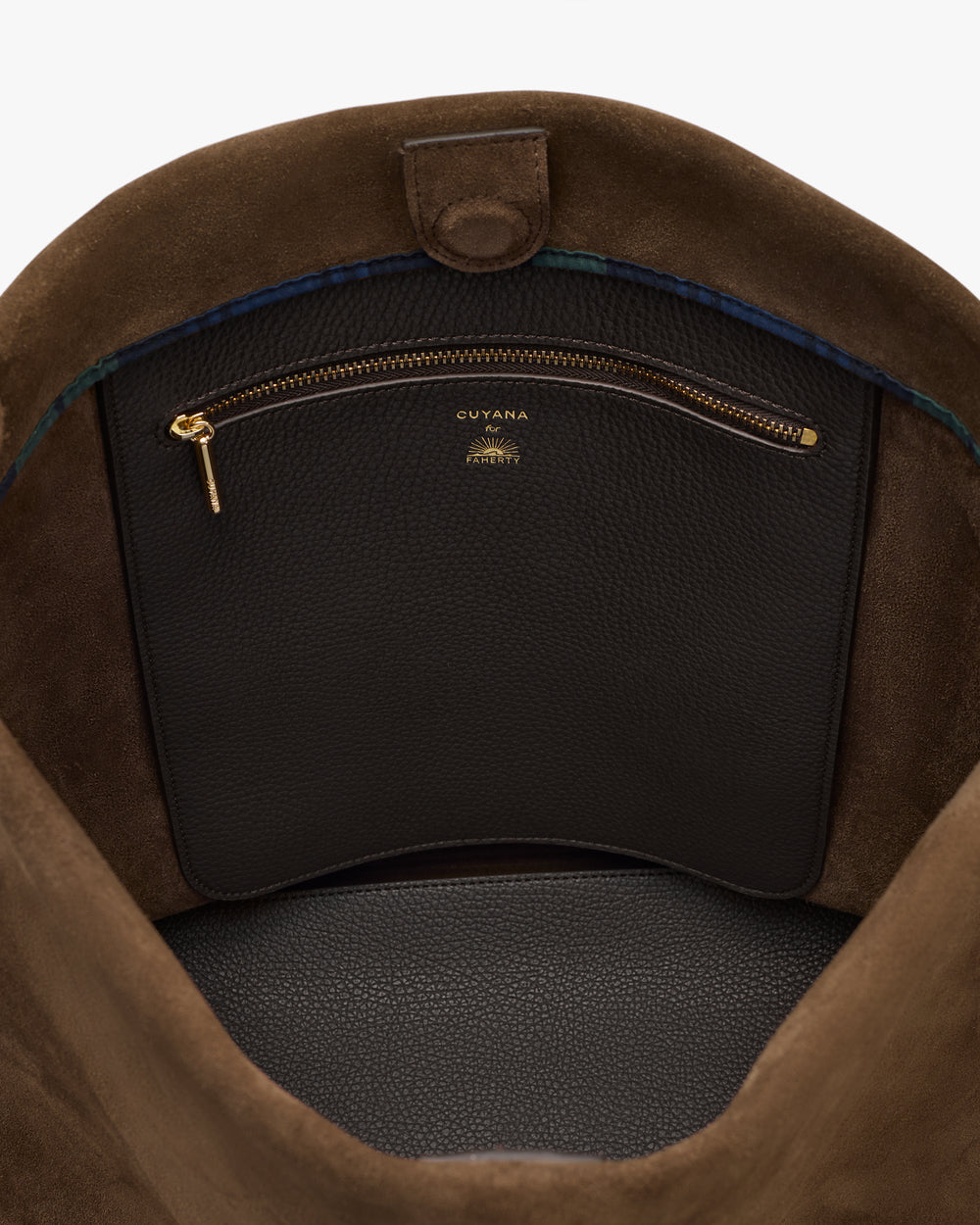 Open bag interior showing a zippered pocket with a branded label.