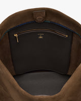 Open bag interior showing a zippered pocket with a branded label.