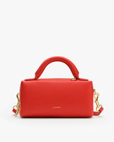 Rectangular handbag with a top handle and gold clasps.