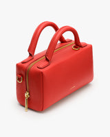 Rectangular handbag with two handles and a zipper.