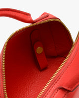 Open travel bag showing interior and snap button closure