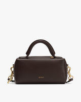 Handbag with a top handle and a detachable shoulder strap.