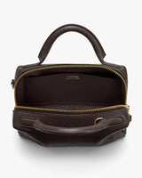 Small handbag with open zipper and top handle