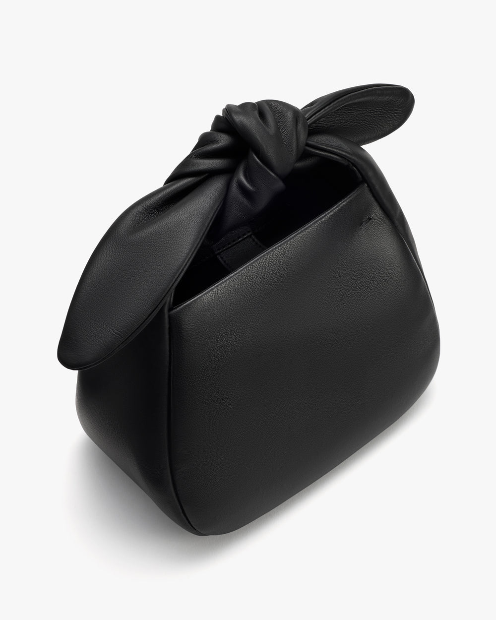 Handbag with a knotted handle and open compartment