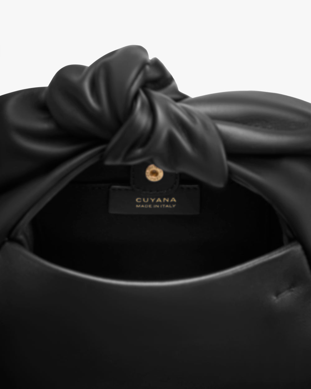 Bag with knotted detail and visible label inside