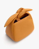 Handbag with a knotted handle design