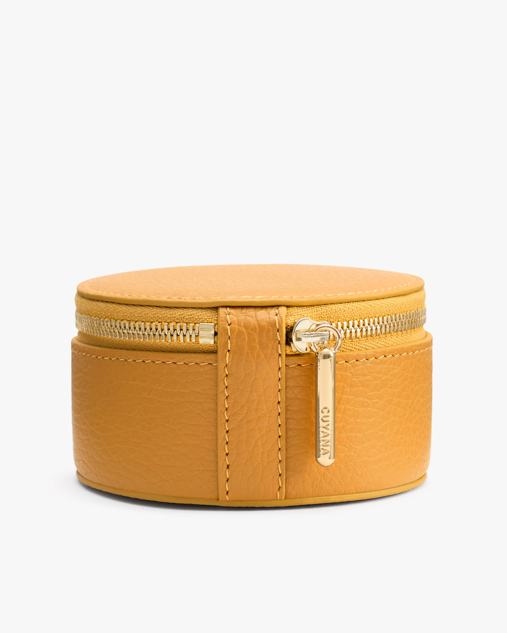 Small round leather zippered case with a metal tag.