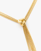 Necklace with a knot design and multiple chain strands.