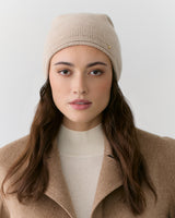 Person wearing a beanie and a coat.